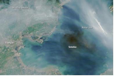 Satellite image of smoke produced by massive explosions in Tianjin (Image: NASA)