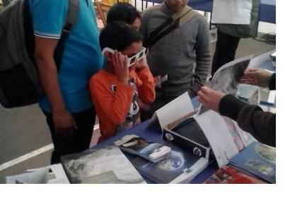 Visitors of all ages stop by the stand