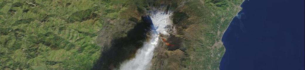 The Operational Land Imager (OLI) on the Landsat 8 satellite acquired this top image of Mount Etna on December 28, 2018. The image highlights the active vent and thermal infrared signature from lava flows, which can be seen near the newly formed fissure on the southeastern side of the volcano. The image was created with data from OLI (bands 4-3-2) and the Thermal Infrared Sensor (TIRS) on Landsat 8. Image: NASA.